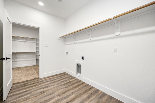 laundry area with hardwood / wood-style flooring, washer hookup, and electric dryer hookup