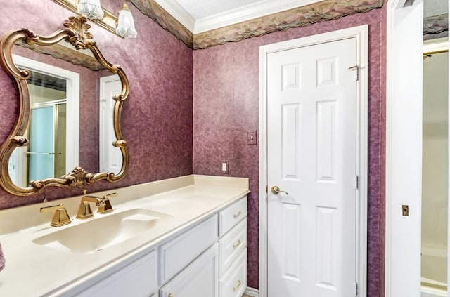 bathroom featuring walk in shower, ornamental molding, and vanity