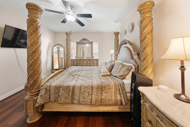 bedroom with dark wood-type flooring, decorative columns, and ceiling fan