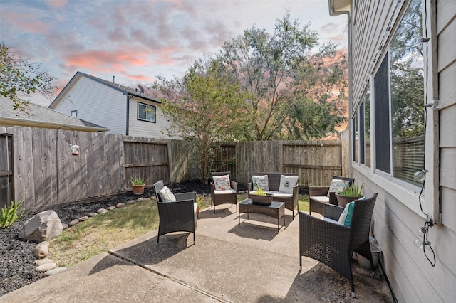 patio terrace at dusk with an outdoor hangout area