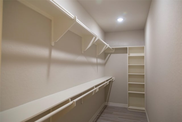 spacious closet with wood finished floors