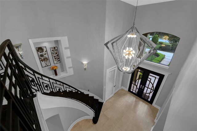 7611 Kings River Ln, Humble, TX 77346 - foyer with a high ceiling, a chandelier, baseboards, and stairs