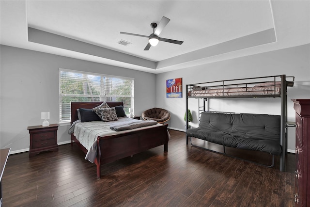 7611 Kings River Ln, Humble, TX 77346 - bedroom with a raised ceiling, wood finished floors, baseboards, and ceiling fan