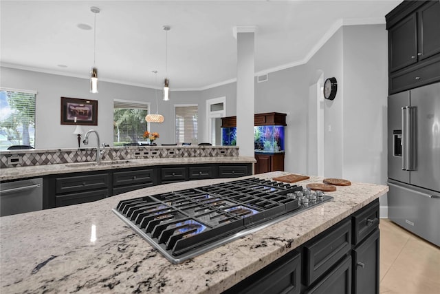 7611 Kings River Ln, Humble, TX 77346 - kitchen with stainless steel appliances, a sink, light stone countertops, light tile patterned floors, and pendant lighting