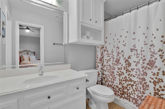 7611 Kings River Ln, Humble, TX 77346 - full bath with vanity, toilet, ensuite bathroom, tile patterned flooring, and a shower with shower curtain