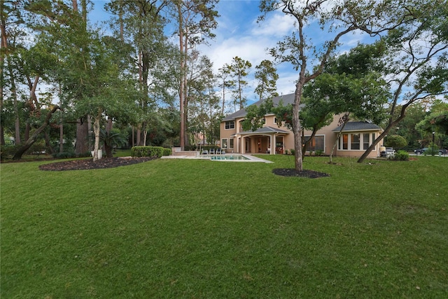7611 Kings River Ln, Humble, TX 77346 - view of grassy yard featuring an outdoor pool and a patio