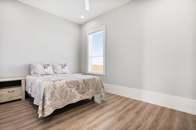 bedroom featuring hardwood / wood-style flooring