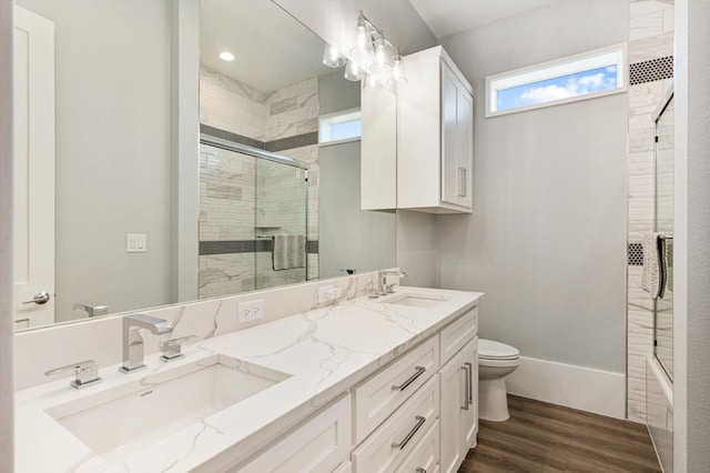 bathroom with vanity, hardwood / wood-style floors, and toilet