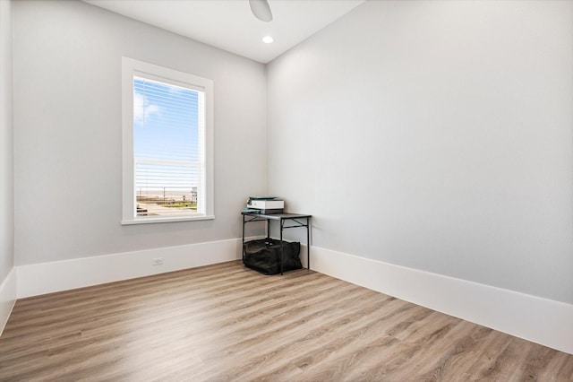 empty room featuring ceiling fan and light wood-type flooring