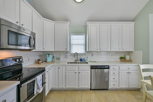 kitchen with white cabinetry, appliances with stainless steel finishes, and sink