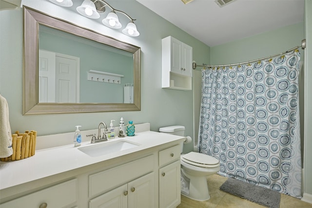 bathroom featuring curtained shower, vanity, and toilet