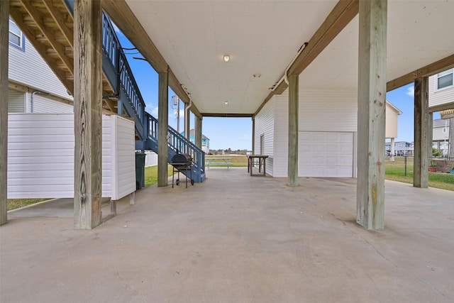 23178 Fresca St, Galveston, TX 77554 - view of patio / terrace featuring stairs and an attached garage