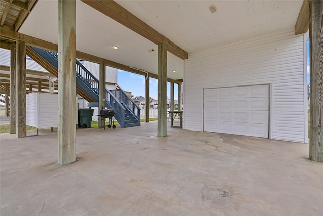 exterior space with a garage and a grill