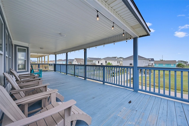 wooden deck featuring a yard