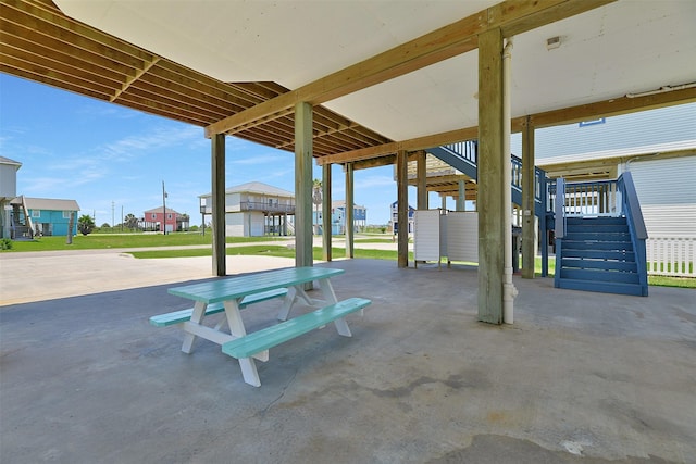 23178 Fresca St, Galveston, TX 77554 - view of patio / terrace with stairs and a residential view