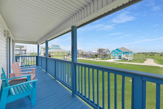 23178 Fresca St, Galveston, TX 77554 - wooden deck with a residential view and a lawn