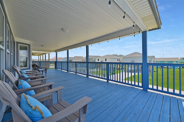 23178 Fresca St, Galveston, TX 77554 - wooden terrace with a lawn and a residential view