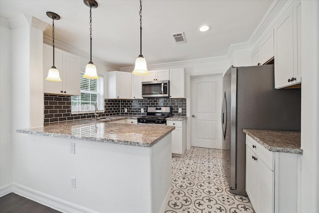 kitchen with pendant lighting, stainless steel appliances, kitchen peninsula, and white cabinets