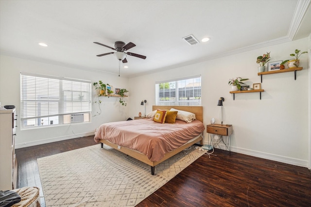 bedroom with crown molding, ceiling fan, and dark hardwood / wood-style floors