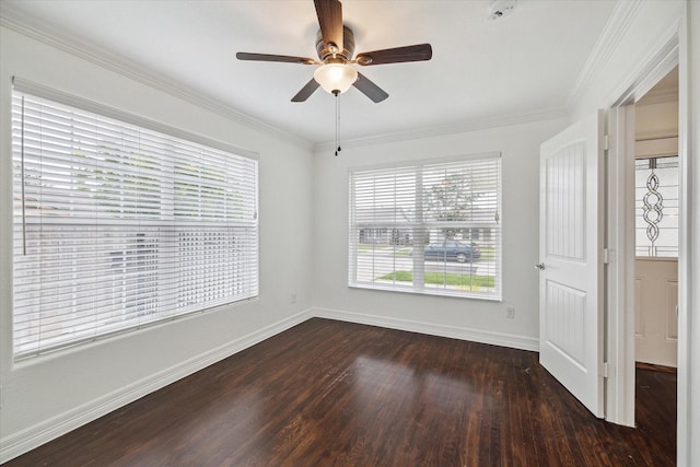 unfurnished room with ornamental molding, plenty of natural light, dark hardwood / wood-style floors, and ceiling fan