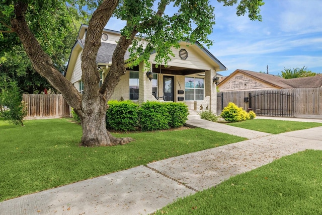 bungalow-style house with a front lawn