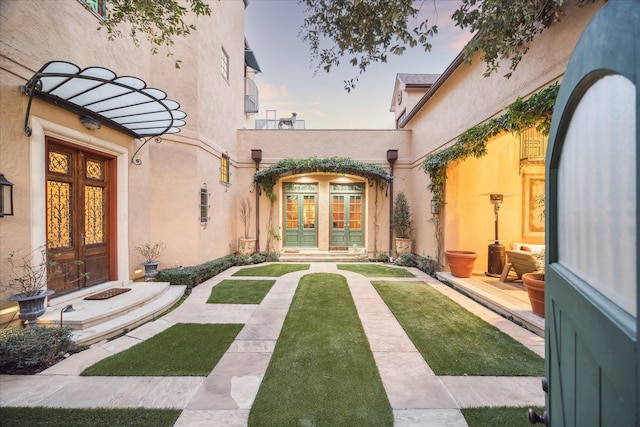 view of yard with french doors
