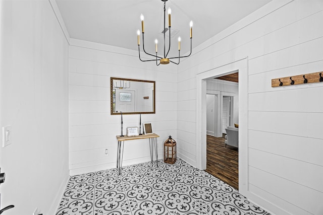 dining room with crown molding and a chandelier