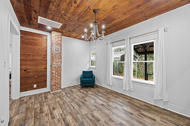 interior space with an inviting chandelier, wood ceiling, and dark hardwood / wood-style floors