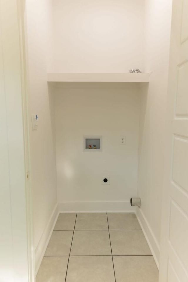 laundry area with washer hookup, hookup for an electric dryer, and light tile patterned floors