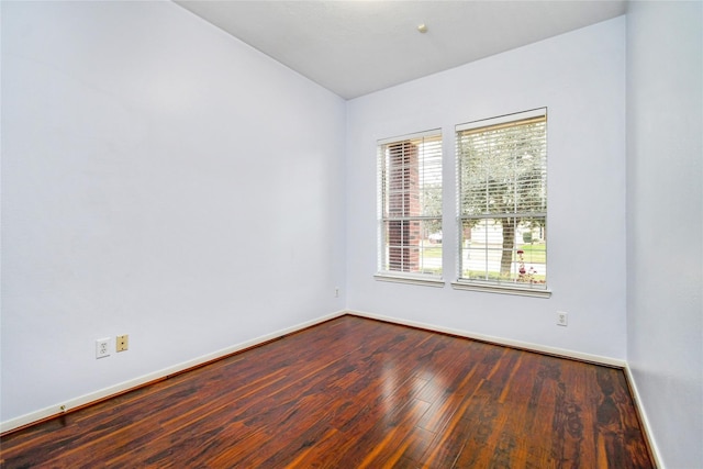 empty room with hardwood / wood-style floors