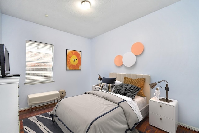 bedroom featuring dark hardwood / wood-style floors