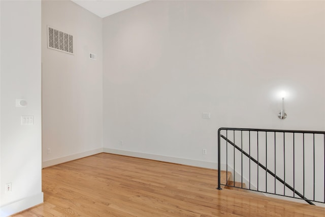 empty room with light hardwood / wood-style flooring