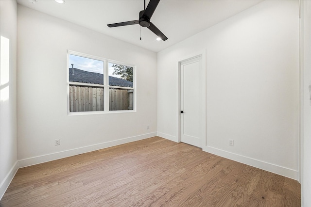 spare room featuring ceiling fan and light hardwood / wood-style flooring