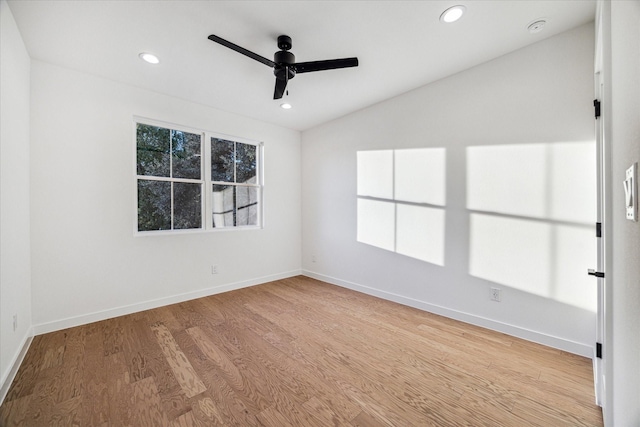 unfurnished room with vaulted ceiling, ceiling fan, and light wood-type flooring