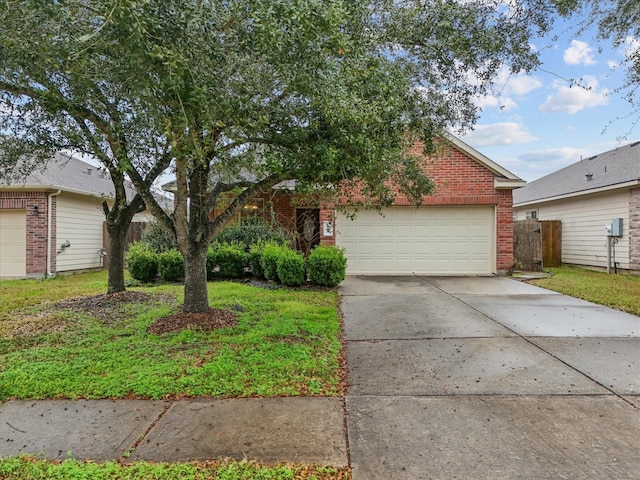 view of front of home featuring a garage and a front yard