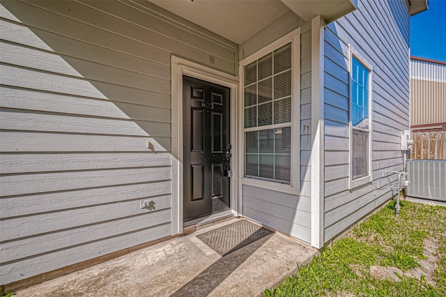 property entrance with central AC unit