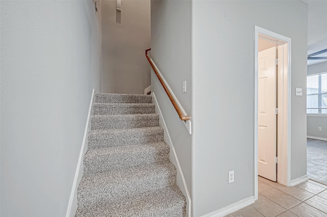 staircase with tile patterned floors