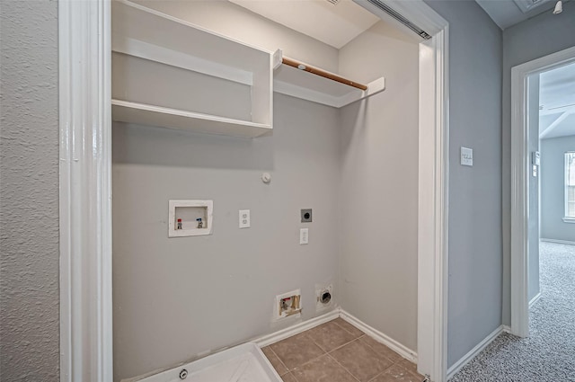 clothes washing area with tile patterned floors, hookup for an electric dryer, gas dryer hookup, and hookup for a washing machine