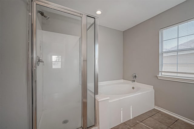 bathroom featuring tile patterned floors, separate shower and tub, and a healthy amount of sunlight