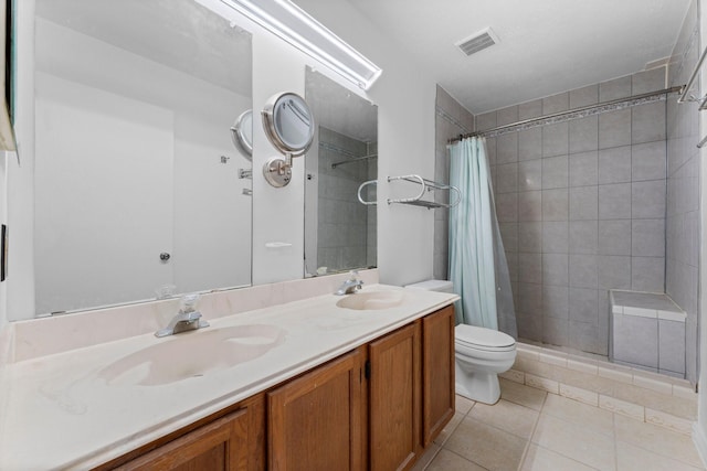 bathroom featuring tile patterned flooring, vanity, toilet, and a shower with curtain