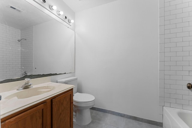 full bathroom with vanity, toilet, tiled shower / bath combo, and tile patterned flooring