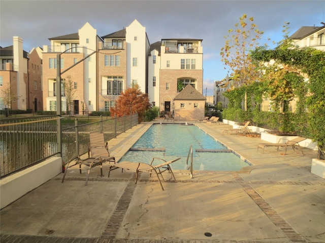 view of swimming pool featuring a patio