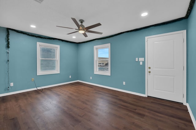 spare room featuring recessed lighting, ceiling fan, baseboards, and wood finished floors