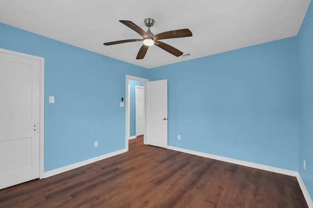 unfurnished bedroom featuring dark hardwood / wood-style floors and ceiling fan