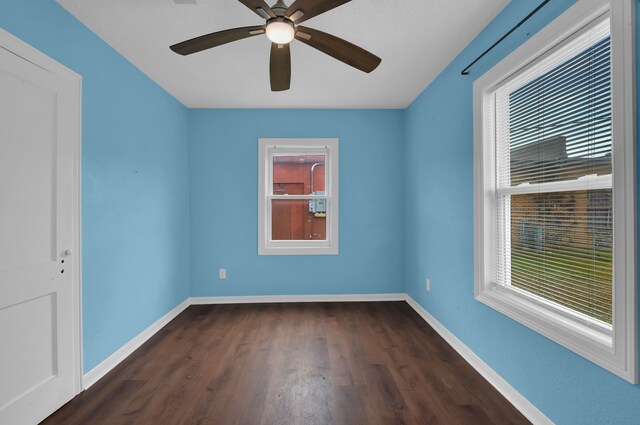 617 4th Ave N, Texas City, TX 77590 - spare room featuring healthy amount of natural light, dark wood-style floors, and a ceiling fan