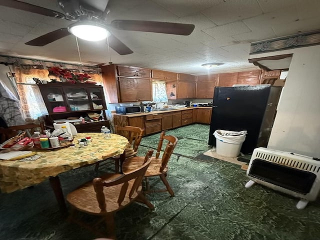 kitchen with ceiling fan and heating unit