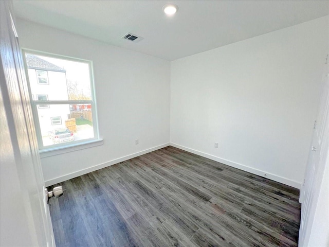 empty room featuring dark hardwood / wood-style floors