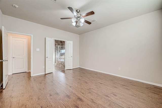 unfurnished room featuring hardwood / wood-style flooring and ceiling fan