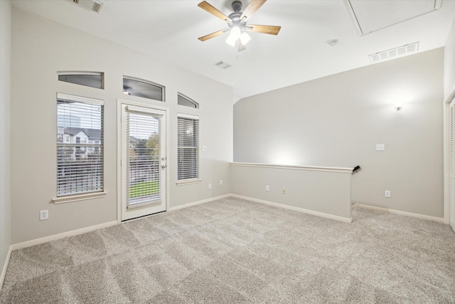 unfurnished room with light carpet, lofted ceiling, and ceiling fan