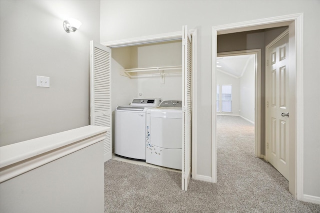 washroom featuring light colored carpet and washer and dryer